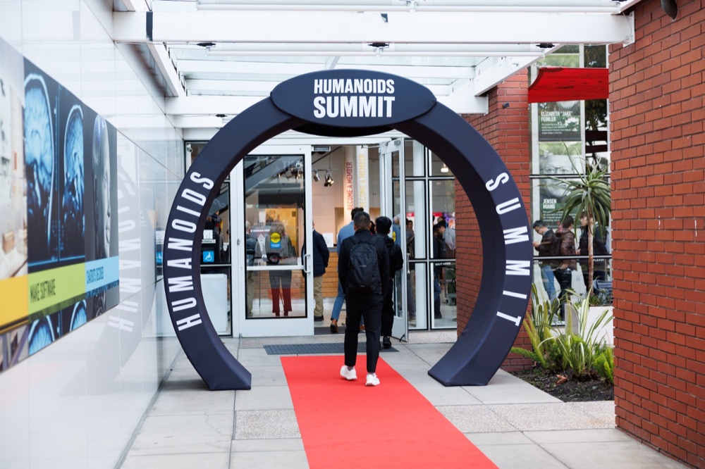 The Humanoids Summit entrance arch with a red carpet